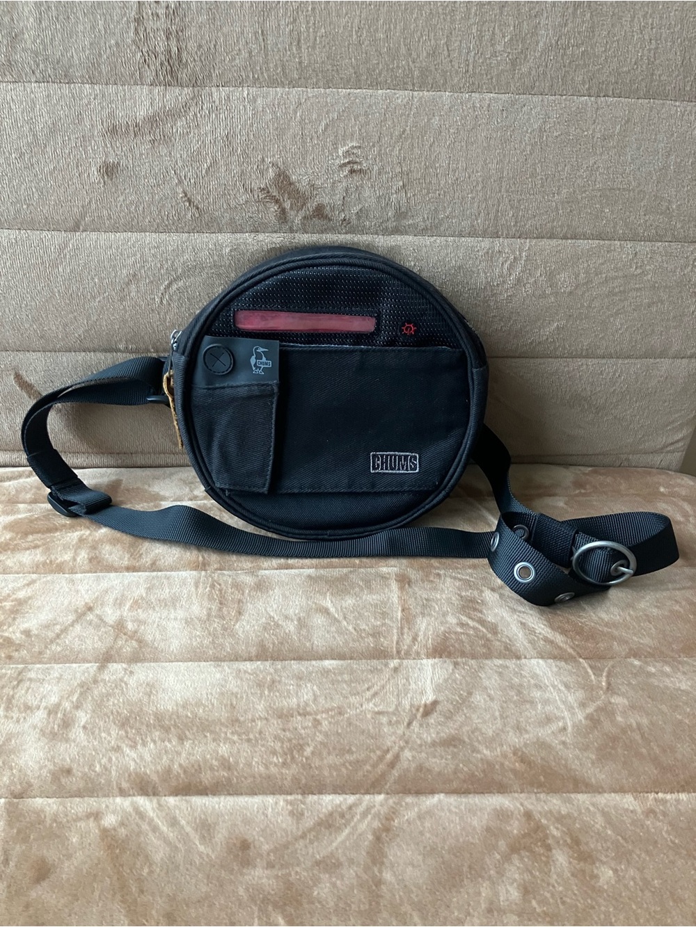 CHUMS Black Round Crossbody Bag with Red Accent